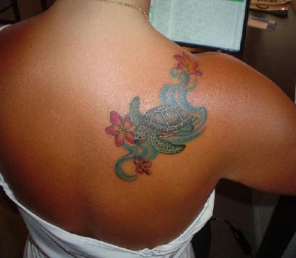 Turtle And Flower Tattoo On Girl's Back