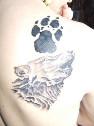 Wolf Head And Paw Tattoo On Back