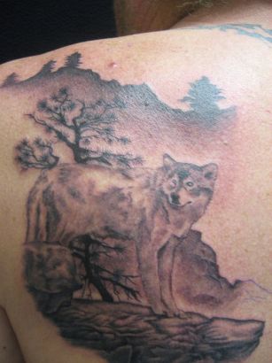 Wolf On Hill Tattoo
