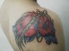 wolf head and sword tattoo