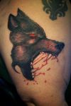 wolf head thigh tattoo