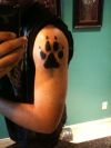 wolf paw tattoo on arm
