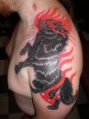 wolf pic tattoo on left shoulder