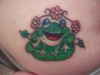 frog and small flower tattoo