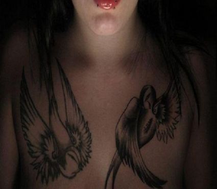 Bird Tattoo On Girl's Chest