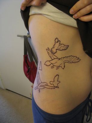 Flying Birds Tattoo On Rib