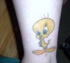 tweety bird tattoo on leg