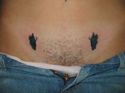 Butterfly Pic Tattoo On Lower Stomach