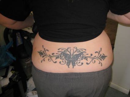 Tribal Butterfly Image Tattoo On Lower Back