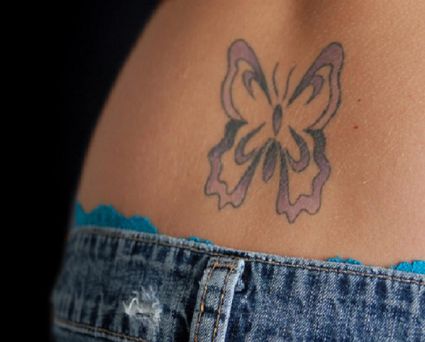 Tribal Butterfly Image Tattoos On Lower Back