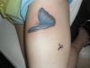 worm and butterfly cover up tattoo