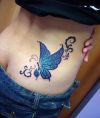 butterfly pic tattoo on upper hip