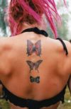 butterfly images tattoo on back of girl