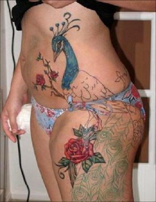 Peacock Tattoo On Side Stomach And Thigh