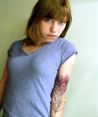 Peacock Feather Tattoo On Girl's Arm