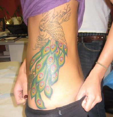 Peacock Tattoos On Rib Of Girl