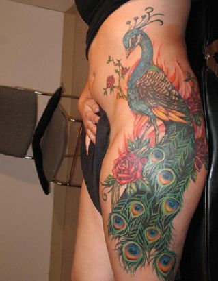 Peacock Tattoo On Thigh And Side Stomach