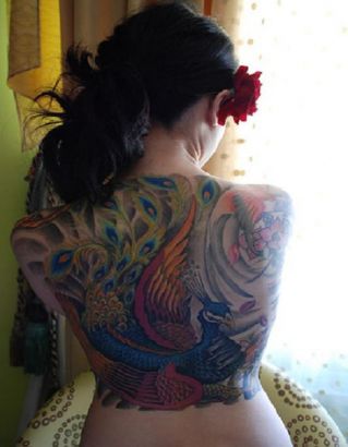Peacock Tattoo Pics On Back Of Girl