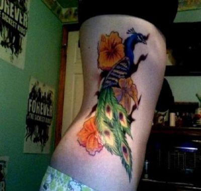 peacock and flower tattoo design on rib of girl. Birds tattoos, Peacock tattoos, Tattoos of Birds, Tattoos of Peacock, Birds tats, Peacock tats, Birds free tattoo designs, Peacock free tattoo designs, Birds tattoos picture, Peacock tattoos picture, Birds pictures tattoos, Peacock pictures tattoos, Birds free tattoos, Peacock free tattoos, Birds tattoo, Peacock tattoo, Birds tattoos idea, Peacock tattoos idea, Birds tattoo ideas, Peacock tattoo ideas, peacock and flower tattoo on rib