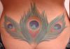 peacock feather tattoo on lower back