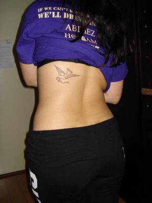 Dove Pic Tattoo On Back Of Girl