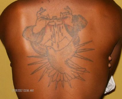 Hands Cross And Dove Pic Tattoo On Back