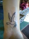 dove tats on wrist