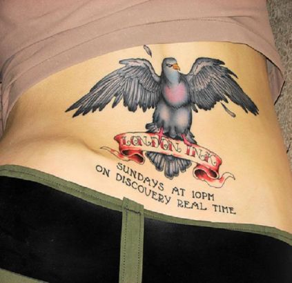 Bird And Text Pic Tattoo On Lower Back