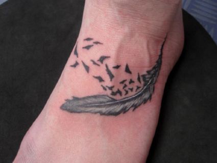 Feather And Flying Bird Pic Tattoo On Feet