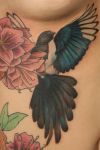 bird and flowers pic tattoo on rib 