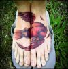dead bird pic tattoo on feet