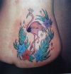 heron and flower pic tattoo on upper hip