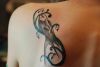 tribal bird pic tattoo on left shoulder blade