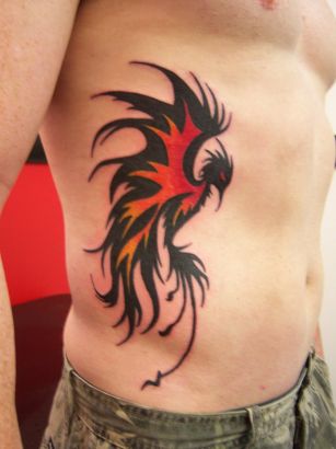 Tribal Phoenix Picture Tattoo On Rib