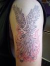 phoenix pic tattoo on left arm