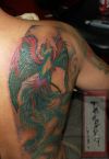 tats of phoenix on side back