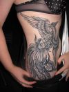 phoenix tats design on rib