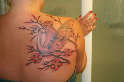 swan tattoos design with flower image showing on girl's back. Birds tattoos, swan tattoos, Tattoos of Birds, Tattoos of swan, Birds tats, swan tats, Birds free tattoo designs, swan free tattoo designs, Birds tattoos picture, swan tattoos picture, Birds pictures tattoos, swan pictures tattoos, Birds free tattoos, swan free tattoos, Birds tattoo, swan tattoo, Birds tattoos idea, swan tattoos idea, Birds tattoo ideas, swan tattoo ideas, swan image of tattoo
