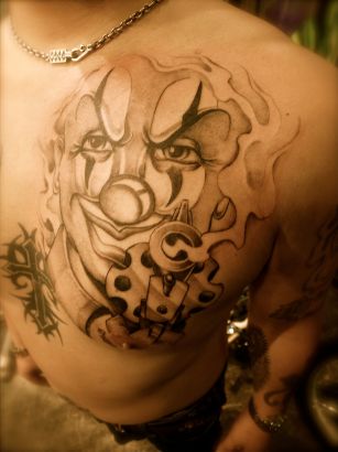 Joker Face Tattoo On Chest