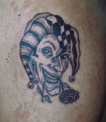 Joker Face With Flower Tattoo