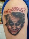 joker face tattoo on arm