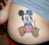 micky mouse tattoo on side back