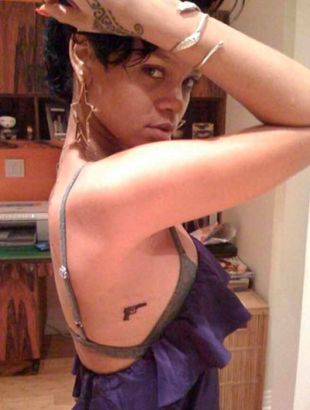 Rihanna Handgun Ribcage Tattoo