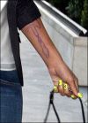 Rihanna guitar arm tattoo