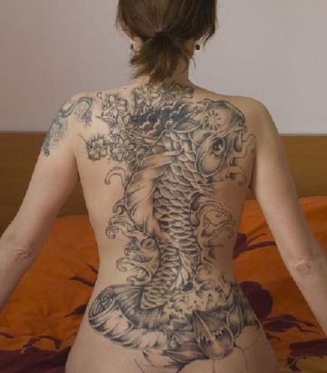 Asian Tattoo On Girl's Back