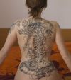 asian tattoo on girl's back