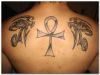 egyptian eyes man's back tats