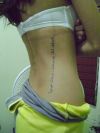 arabic text tattoo on side back