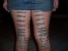 polynesian tattoo on back thigh