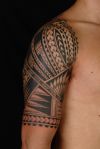 polynesian tattoo on arms